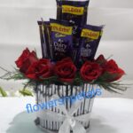 10 red Roses 5 Dairy Milk Chocolate in a Round basket