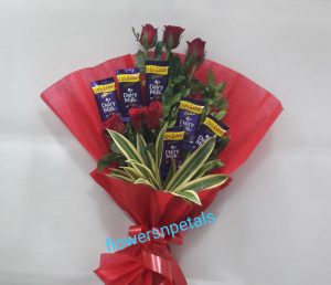 One Sided Hand Bunch with 6 red Roses 6 Dairy Milk Chocolate Red Paper Packing
